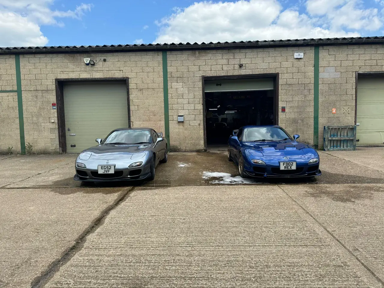 Sports cars outside the Janz Performance workshop in Smallfield